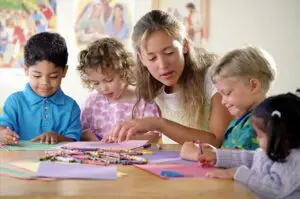 A woman and some children at the table